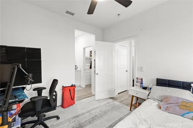 a bedroom with furniture and a rug