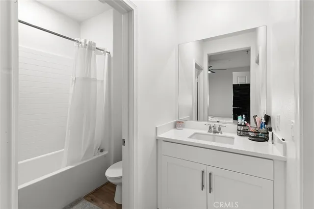 a bathroom with a sink toilet tub and shower