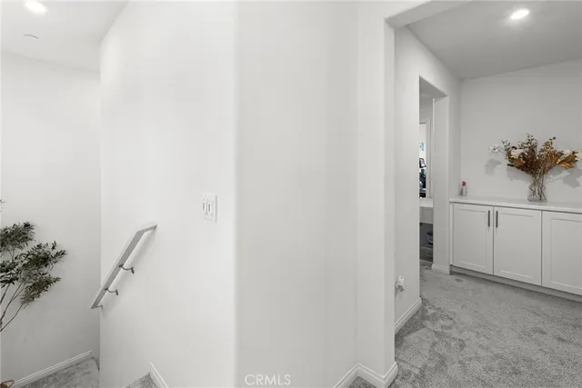 a view of a bathroom from the hallway