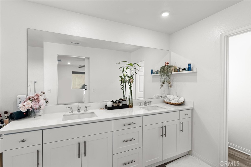 352 Alice Avenue Rialto, CA 92376 - Photo 28 of 41 a bathroom with a double vanity sink and mirror