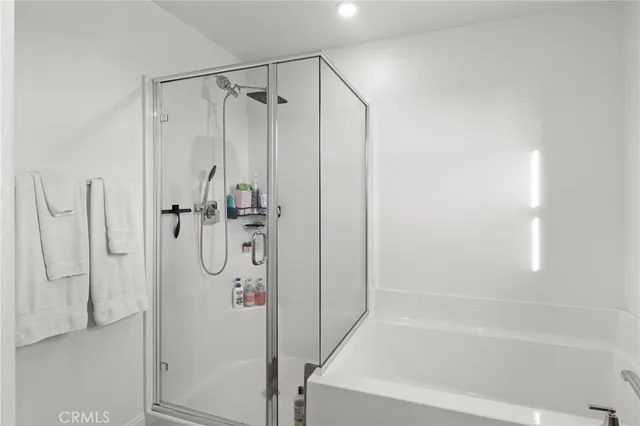 a bathroom with a shower and a tub