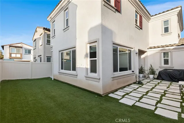 a view of house with backyard