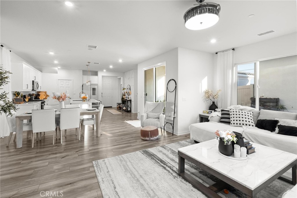 352 Alice Avenue Rialto, CA 92376 - Photo 6 of 41 a living room with lots of furniture and kitchen view