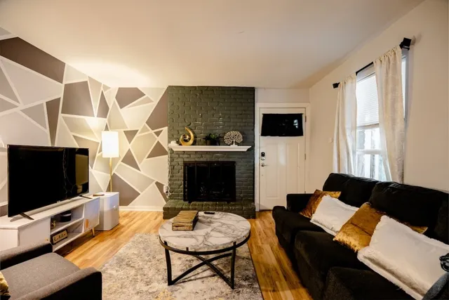 a living room with furniture and a flat screen tv