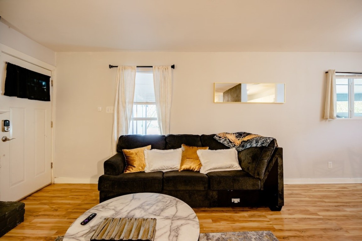 2603 Parker Lane, Unit B Austin, TX 78741 - Photo 12 of 40 a living room with furniture and a flat screen tv