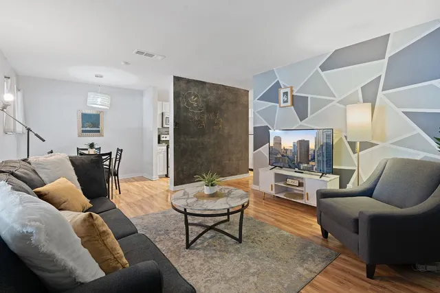 a living room with furniture and a rug