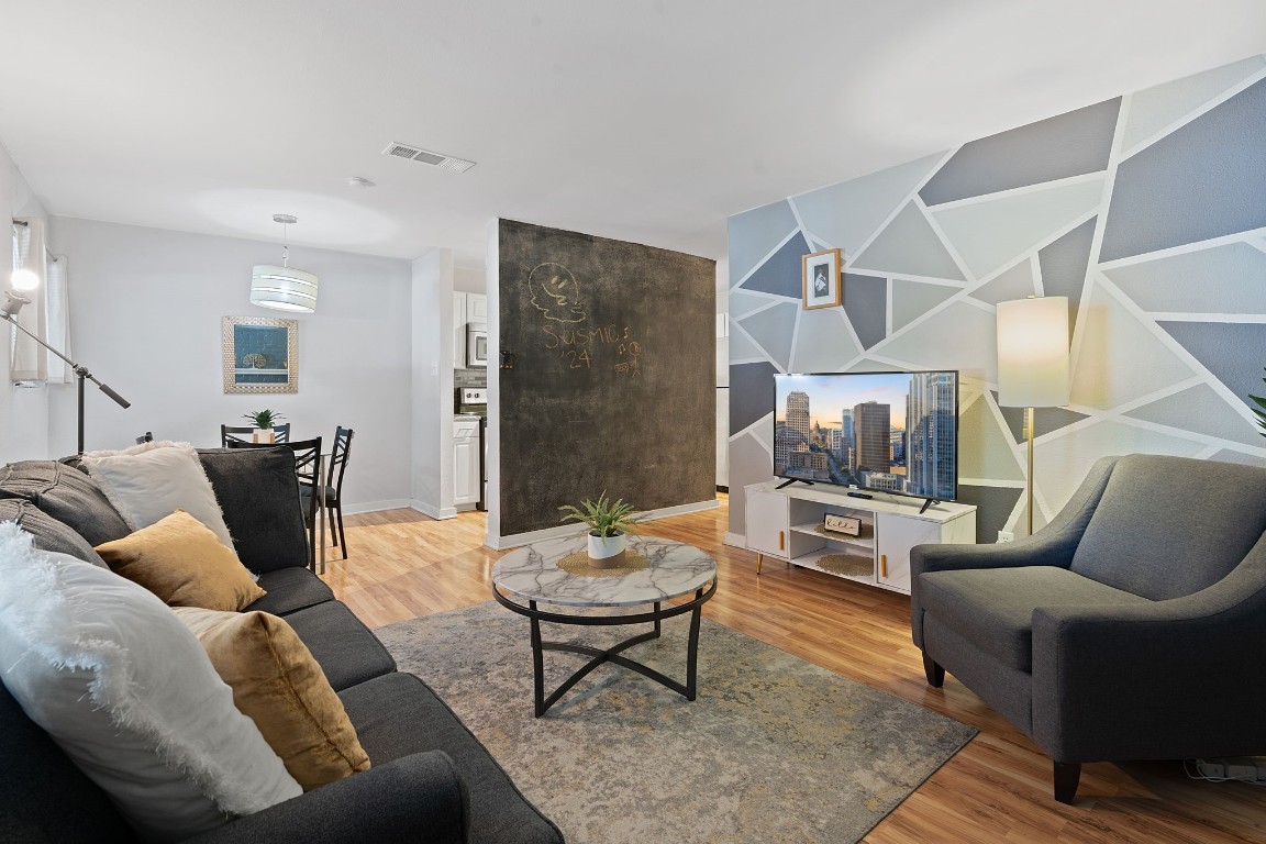 2603 Parker Lane, Unit B Austin, TX 78741 - Photo 2 of 40 a living room with furniture and a rug