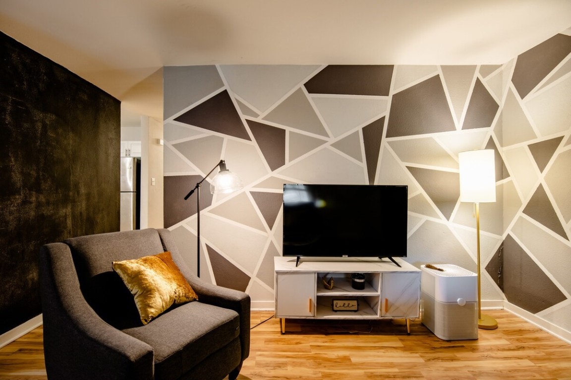 2603 Parker Lane, Unit B Austin, TX 78741 - Photo 8 of 40 a living room with furniture and a flat screen tv