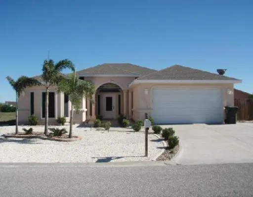 a view of house with yard