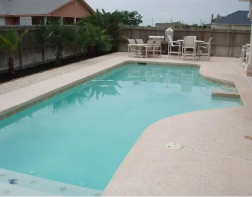 a view of a swimming pool with a patio
