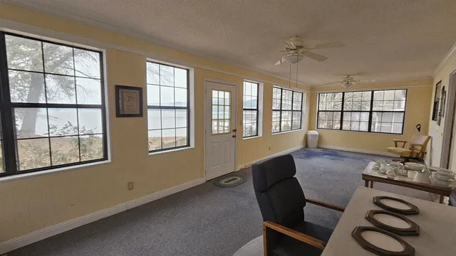 a view of house with yard and green space