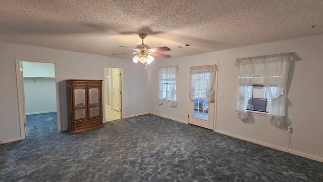 a bathroom with a sink a mirror a vanity and a shower