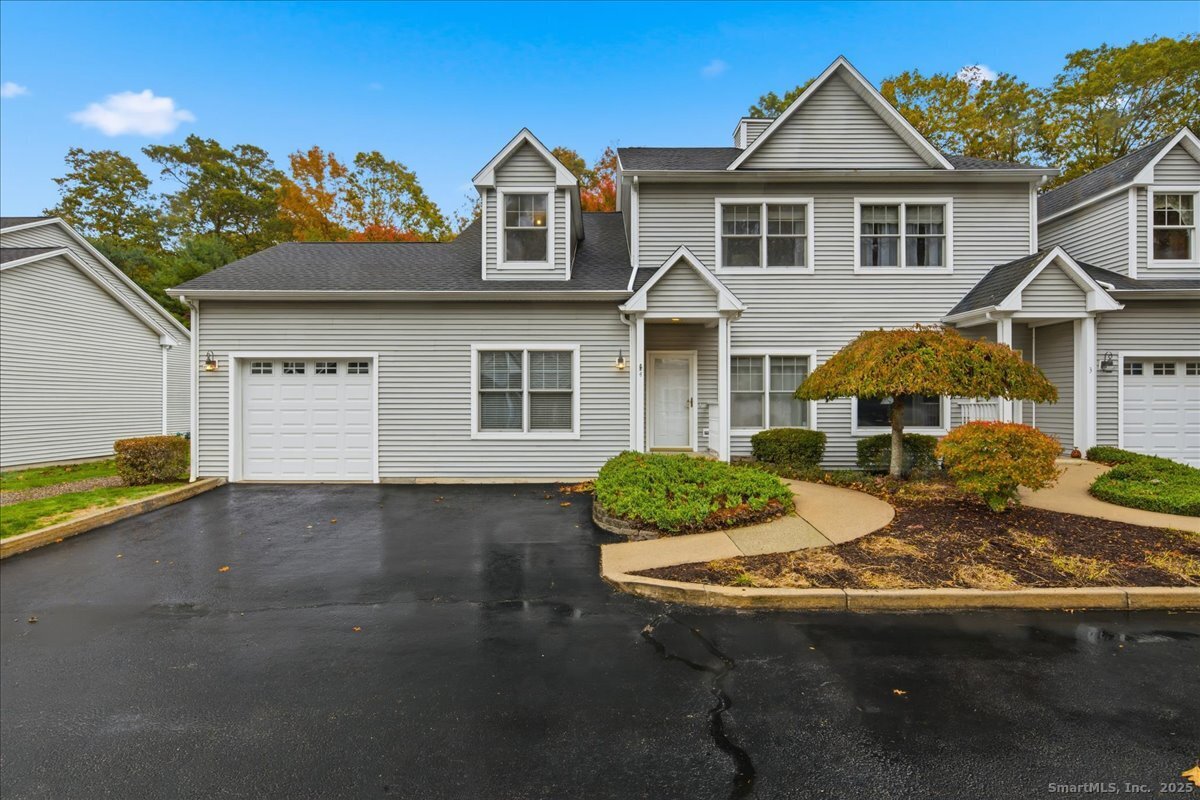 375 Allyn Street, Unit A4 Groton, CT 06355 - Photo 1 of 1 a front view of a house with a yard
