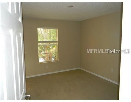a view of a window in an empty room