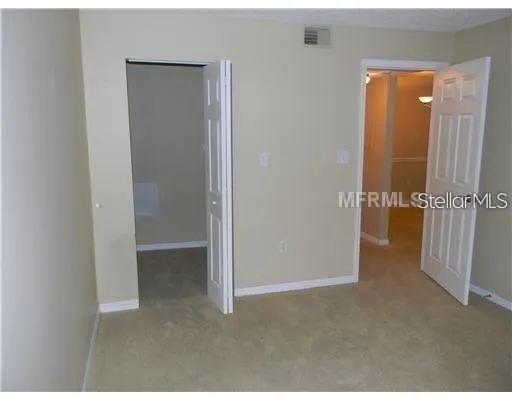 an empty room with wooden door
