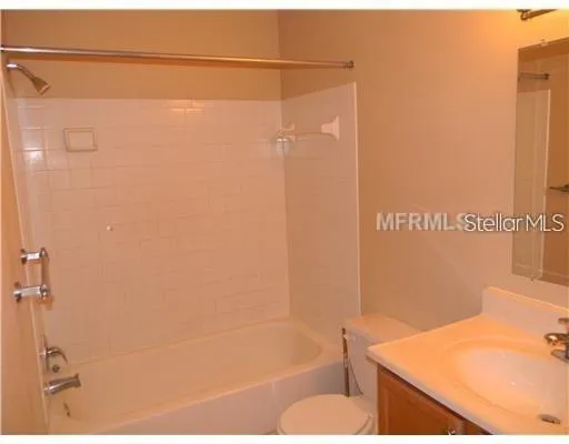 a bathroom with a shower and a bath tub