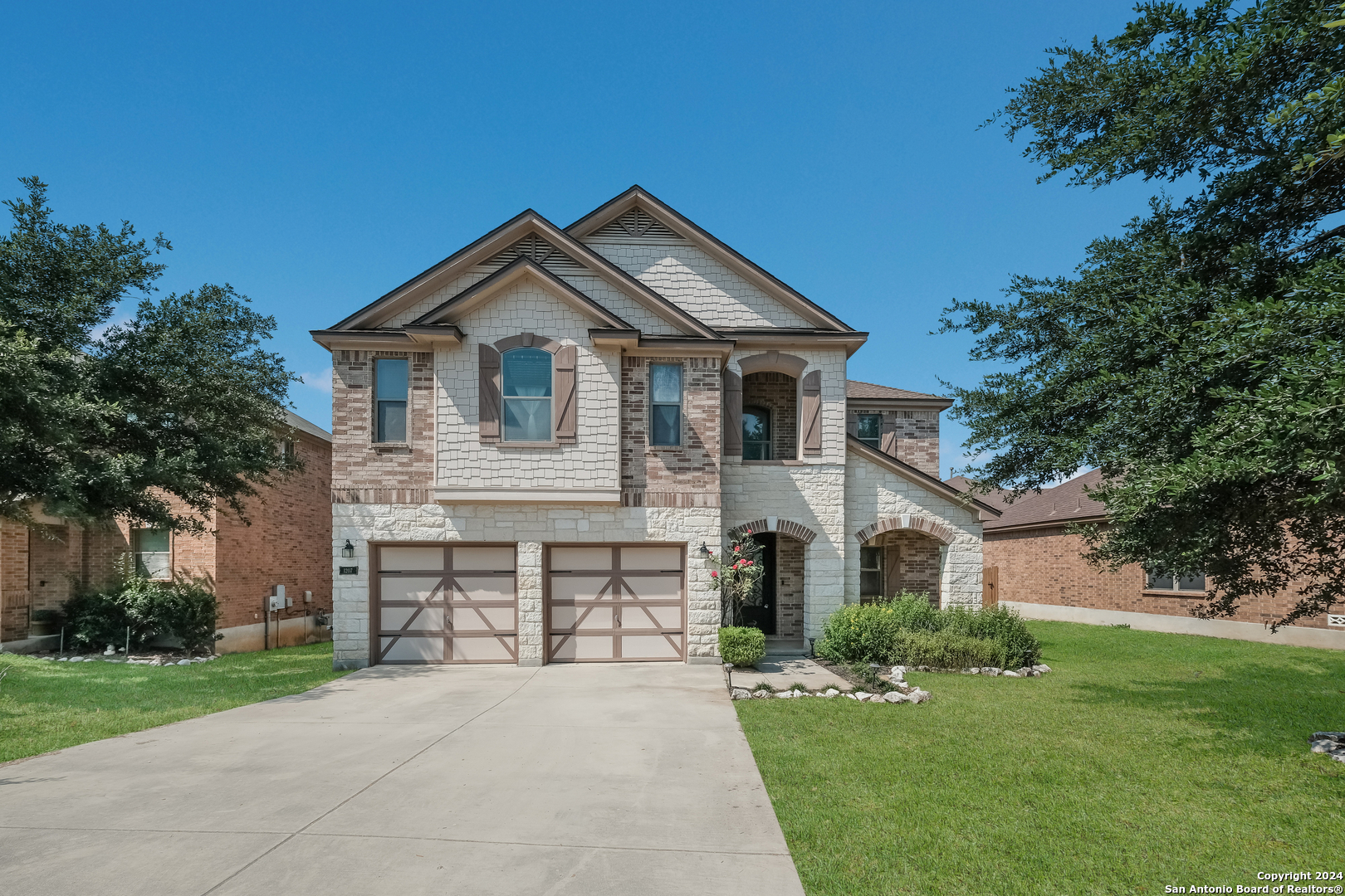 1207 Bridle Bit San Antonio, TX 78258 - Photo 1 of 1 a front view of a house with a garden