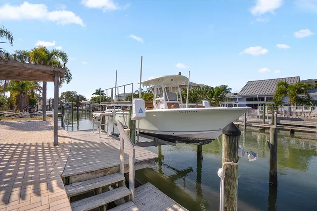 a view of a patio with a table and chairs