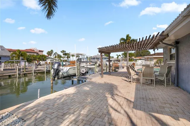 a view of a swimming pool with a lounge chairs