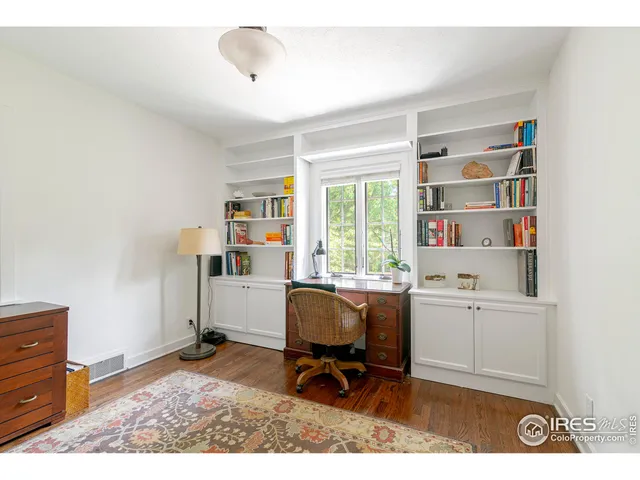 a workspace with furniture and window