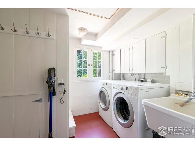 a view of kitchen sink and washer dryer