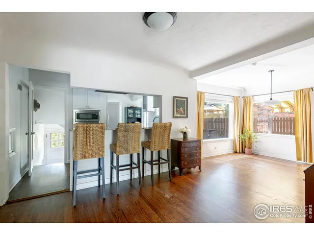 a view of livingroom with furniture wooden floor and windows