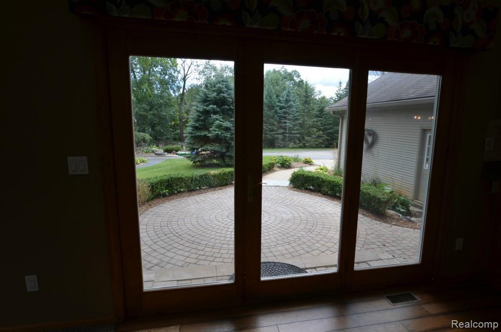 8620 Eaton Road Davisburg, MI 48350 - Photo 14 of 55 DOOR WALL LEADS TO ALLURING PATIO AND BBQ