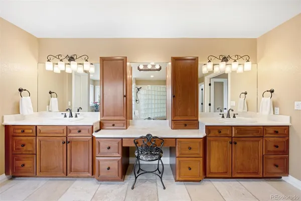 a spacious bathroom with a double vanity sink double and mirror