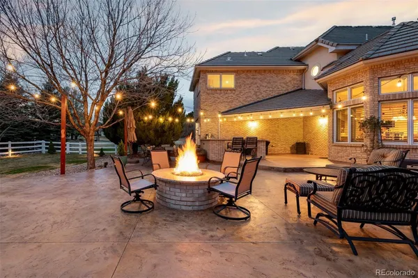 a view of a chairs and tables in a patio