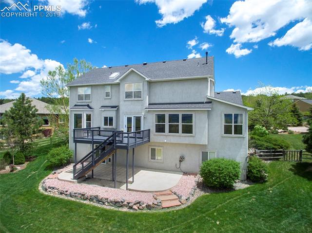 15190 Ridgefield Lane Colorado Springs, CO 80921 - Photo 29 of 31 Beautifully landscaped and large back patio!