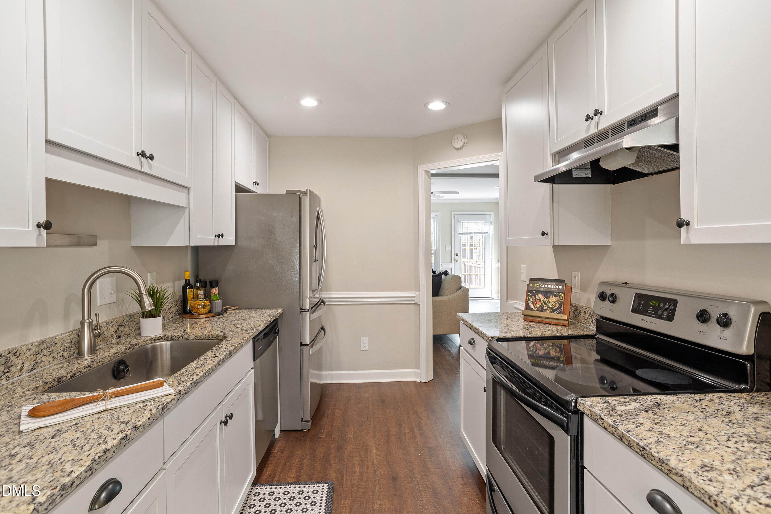 4619 Hershey Court Raleigh, NC 27613 - Photo 10 of 43 a kitchen with stainless steel appliances granite countertop a sink stove and refrigerator