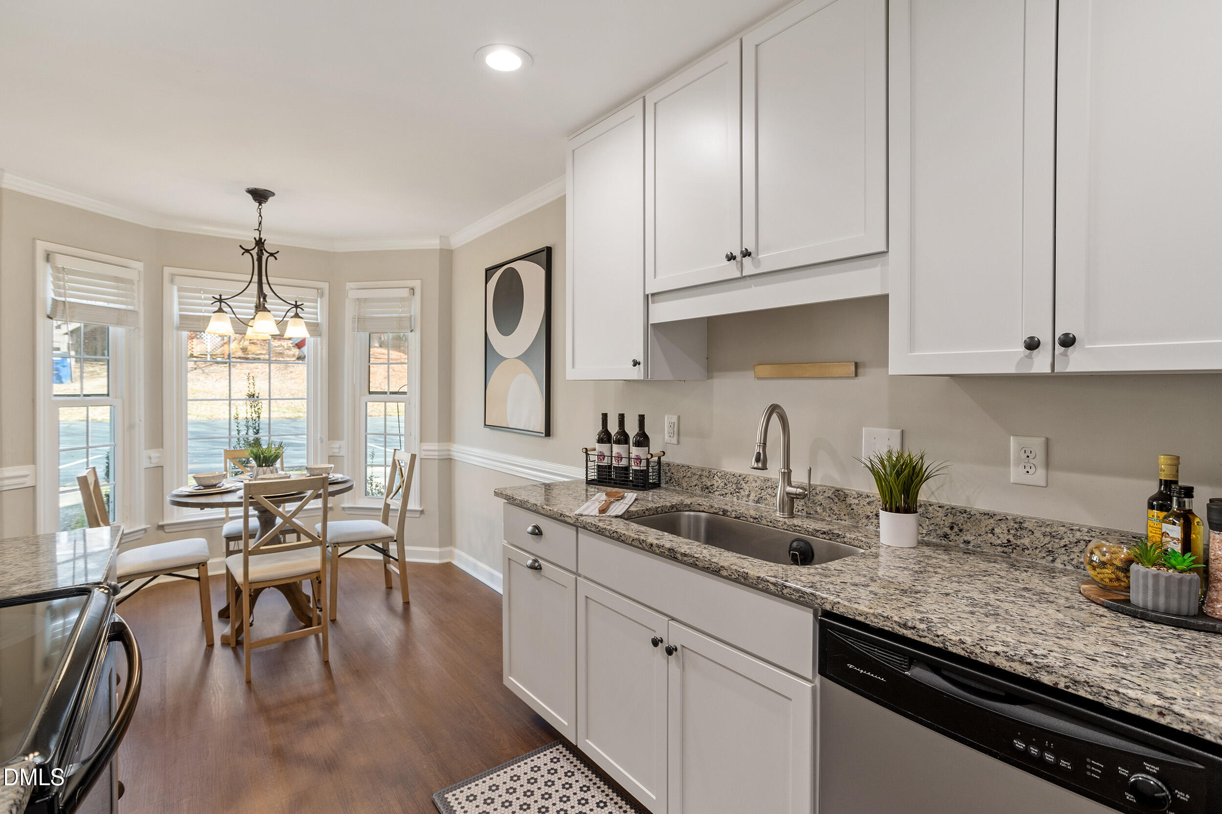 4619 Hershey Court Raleigh, NC 27613 - Photo 13 of 43 a kitchen with sink cabinets and window