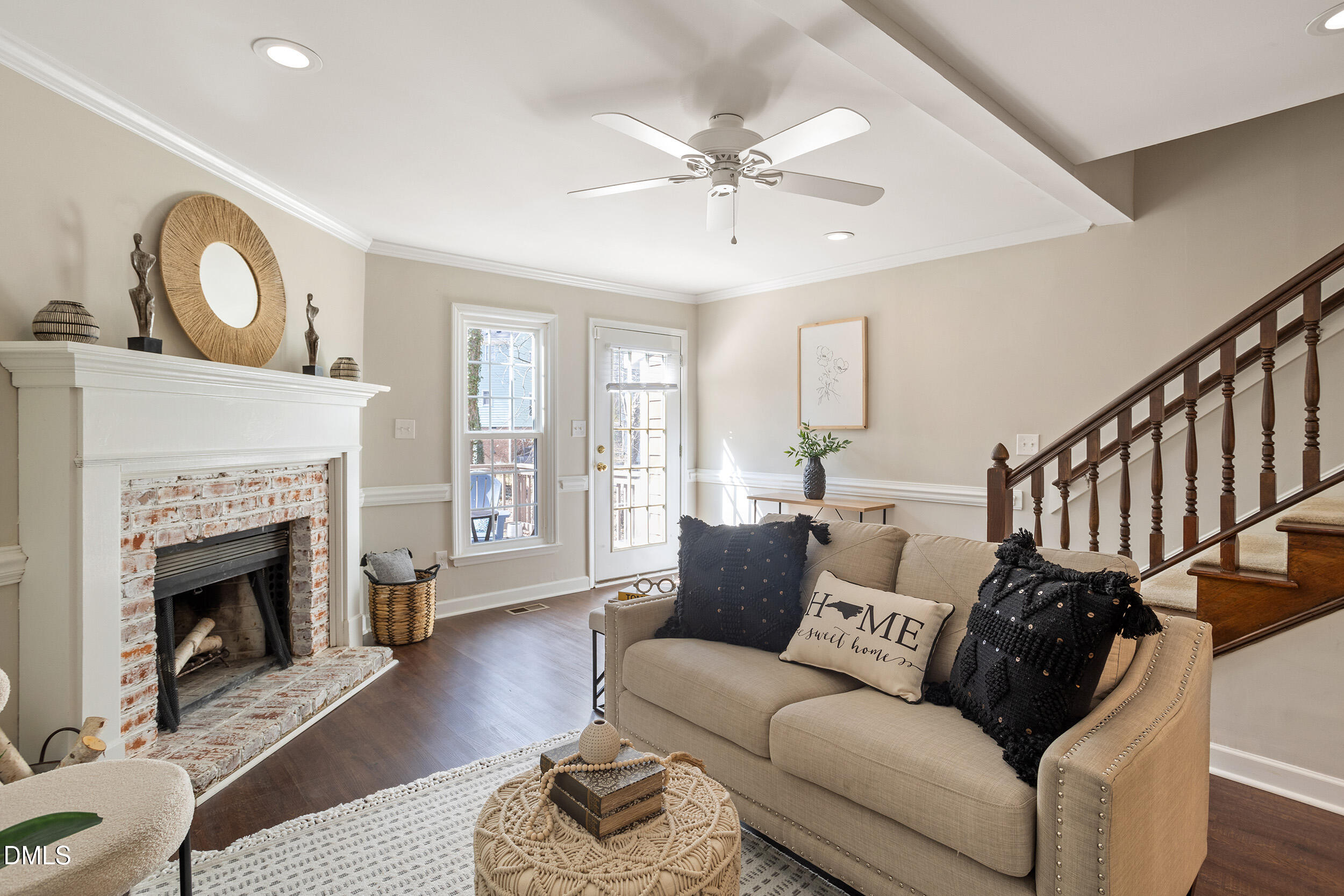 4619 Hershey Court Raleigh, NC 27613 - Photo 16 of 43 a living room with furniture a fireplace and a large window