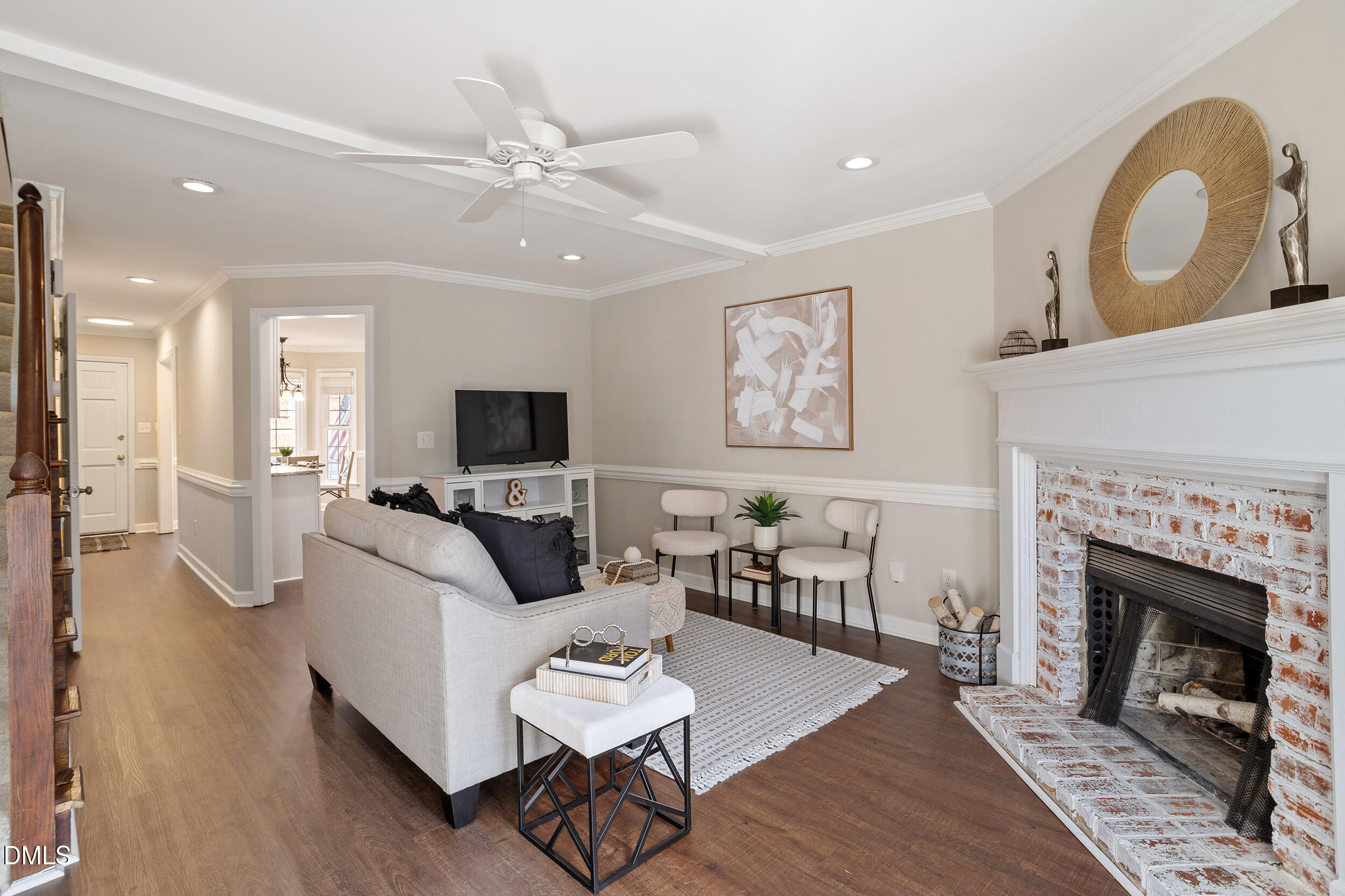 4619 Hershey Court Raleigh, NC 27613 - Photo 18 of 43 a living room with furniture a fireplace and a flat screen tv