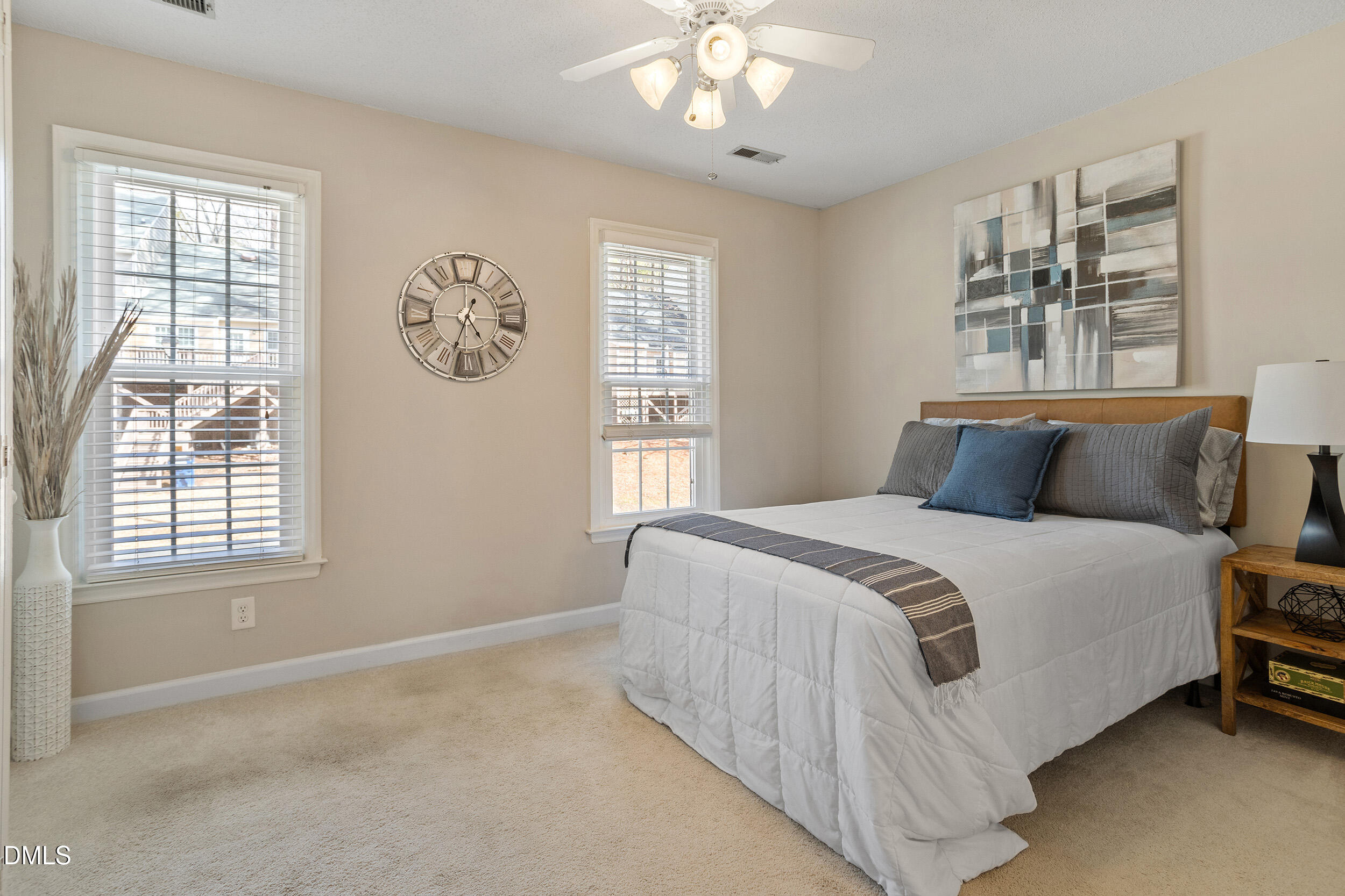4619 Hershey Court Raleigh, NC 27613 - Photo 19 of 43 a bedroom with a bed and a window