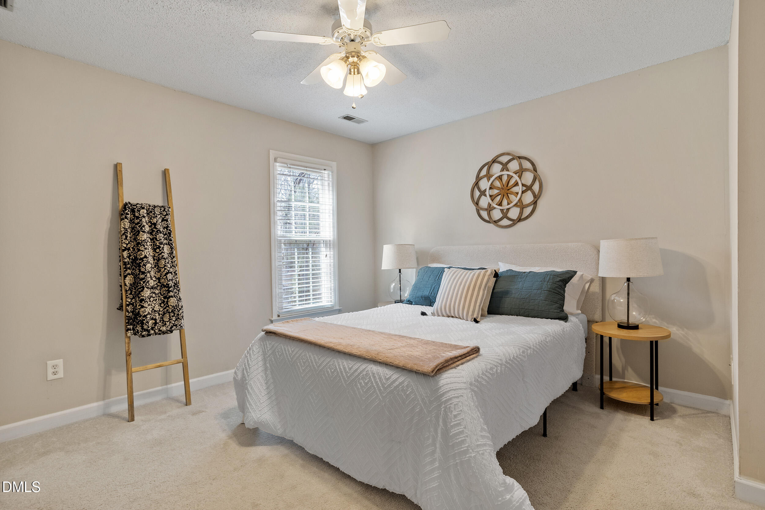 4619 Hershey Court Raleigh, NC 27613 - Photo 23 of 43 a bedroom with a bed and a table