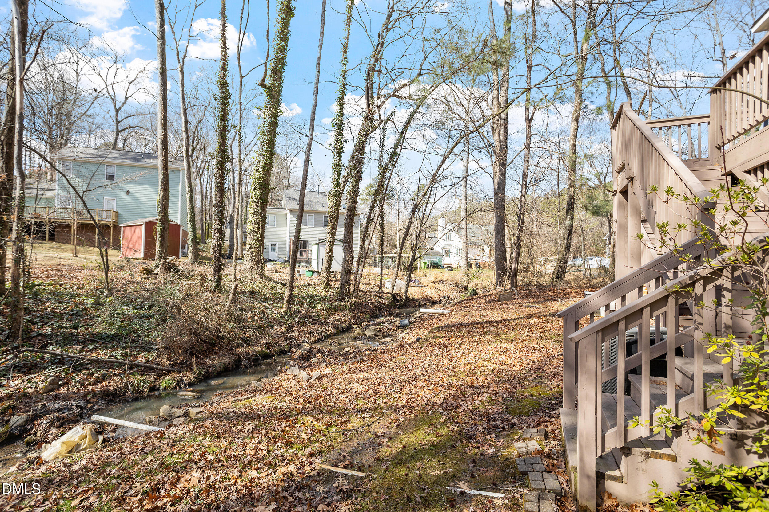4619 Hershey Court Raleigh, NC 27613 - Photo 30 of 43 a view of a large building with large trees