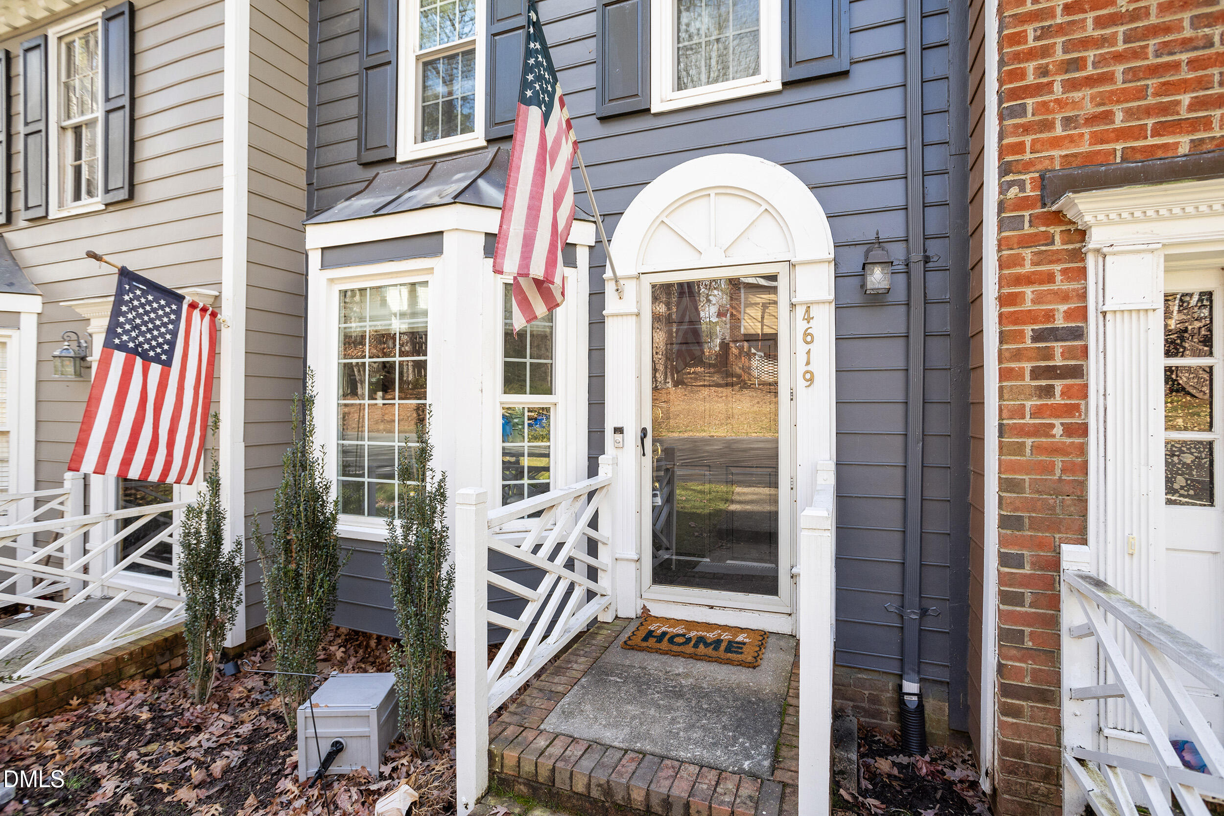 4619 Hershey Court Raleigh, NC 27613 - Photo 3 of 43 a view of a brick house with a floor to ceiling windows and a rug