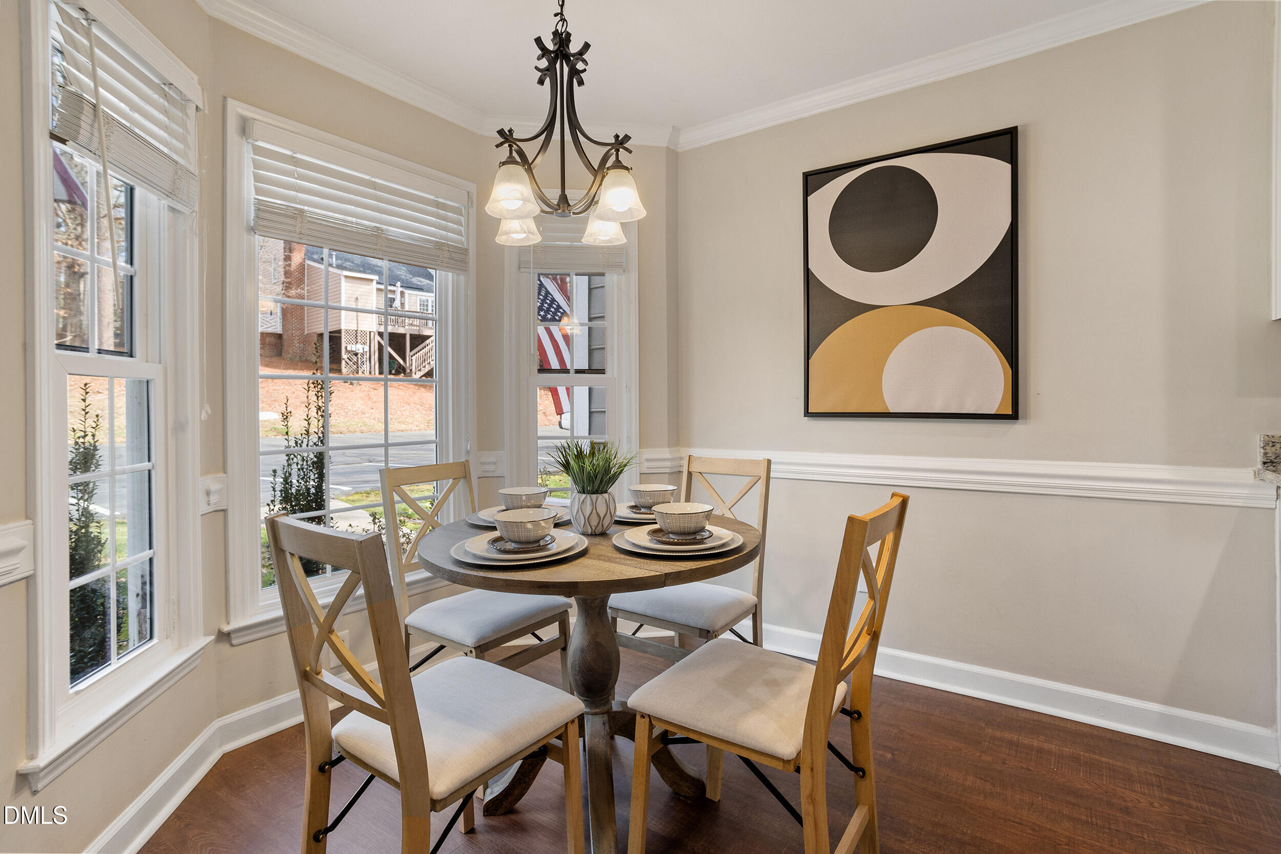 4619 Hershey Court Raleigh, NC 27613 - Photo 6 of 43 a dining room with furniture a chandelier and wooden floor