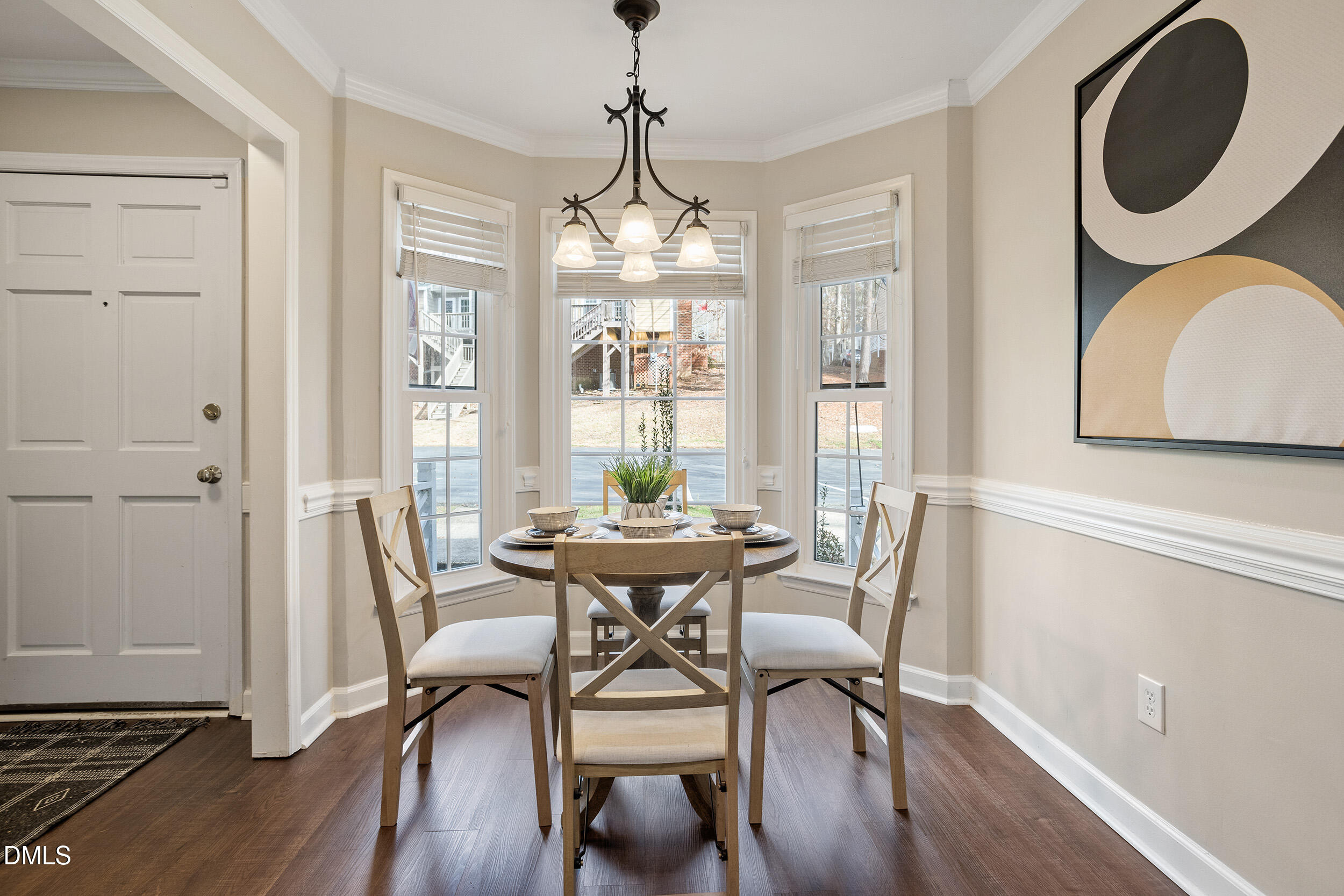 4619 Hershey Court Raleigh, NC 27613 - Photo 7 of 43 a view of a dining room with furniture window and wooden floor