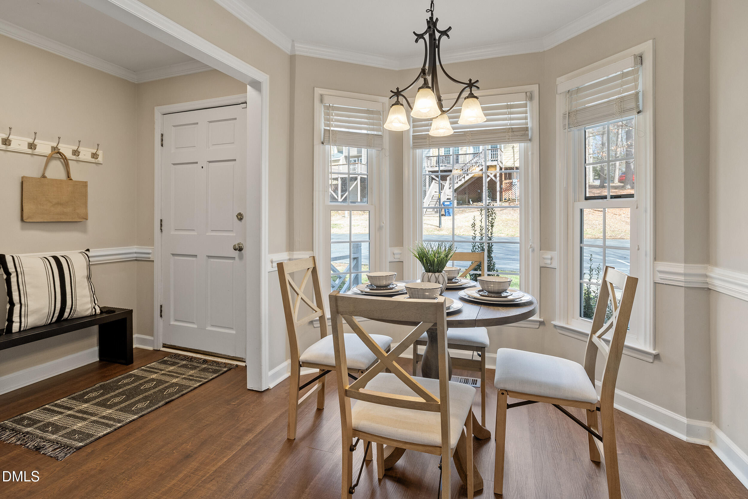 4619 Hershey Court Raleigh, NC 27613 - Photo 8 of 43 a view of a dining room with furniture wooden floor and chandelier