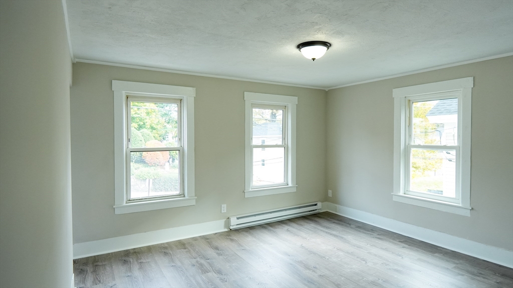 26 Maple Street Spencer, MA 01562 - Photo 18 of 27 a view of an empty room with a window