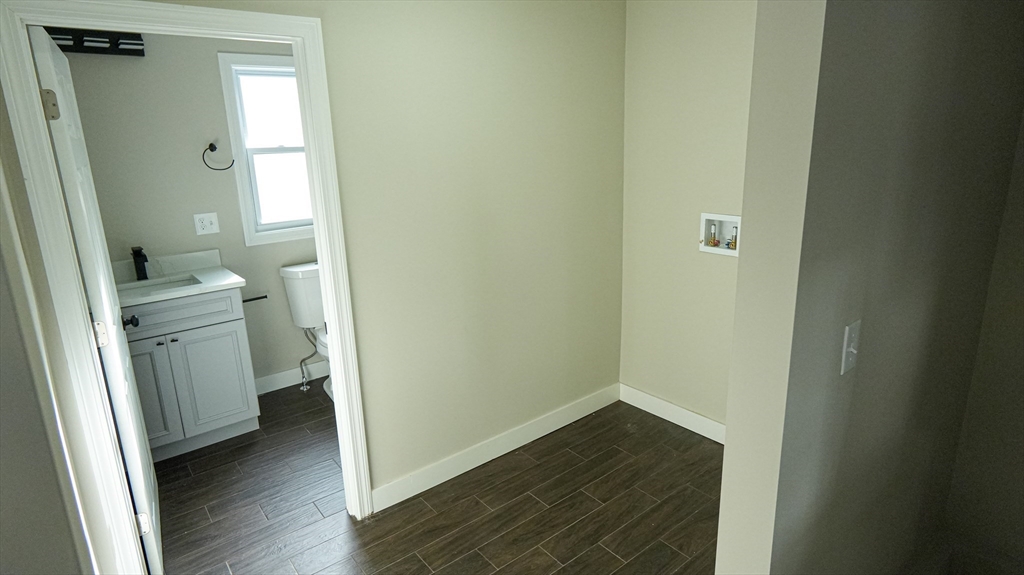 26 Maple Street Spencer, MA 01562 - Photo 7 of 27 a view of a room with wooden floor washer and dryer
