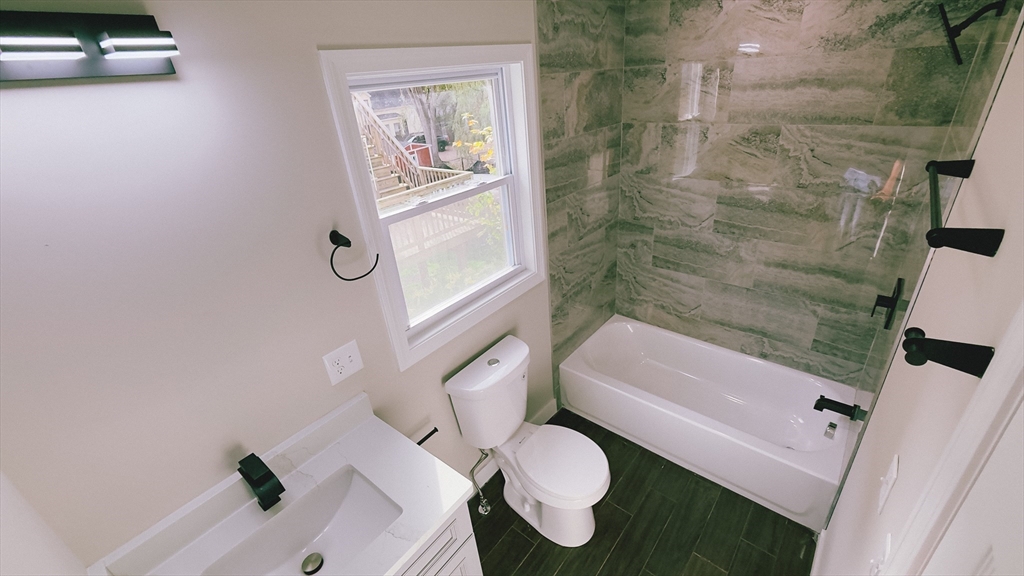 26 Maple Street Spencer, MA 01562 - Photo 9 of 27 a bathroom with a sink and a mirror