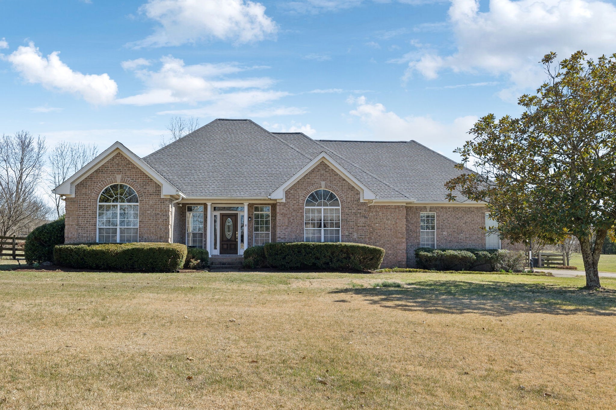 a front view of a house with a yard