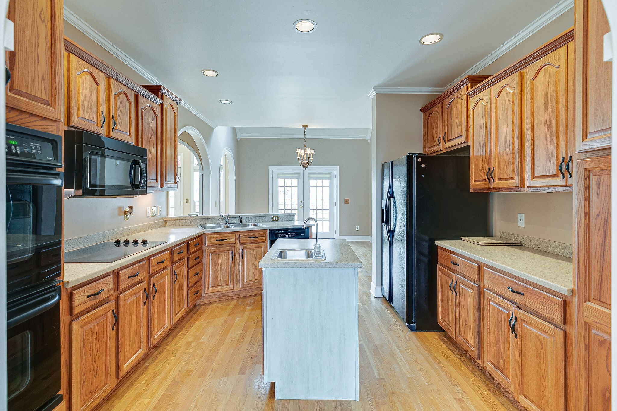Undisclosed Address Franklin, TN 37064 - Photo 17 of 67 a kitchen with stainless steel appliances granite countertop a refrigerator a stove top oven a sink dishwasher and wooden cabinets with wooden floor