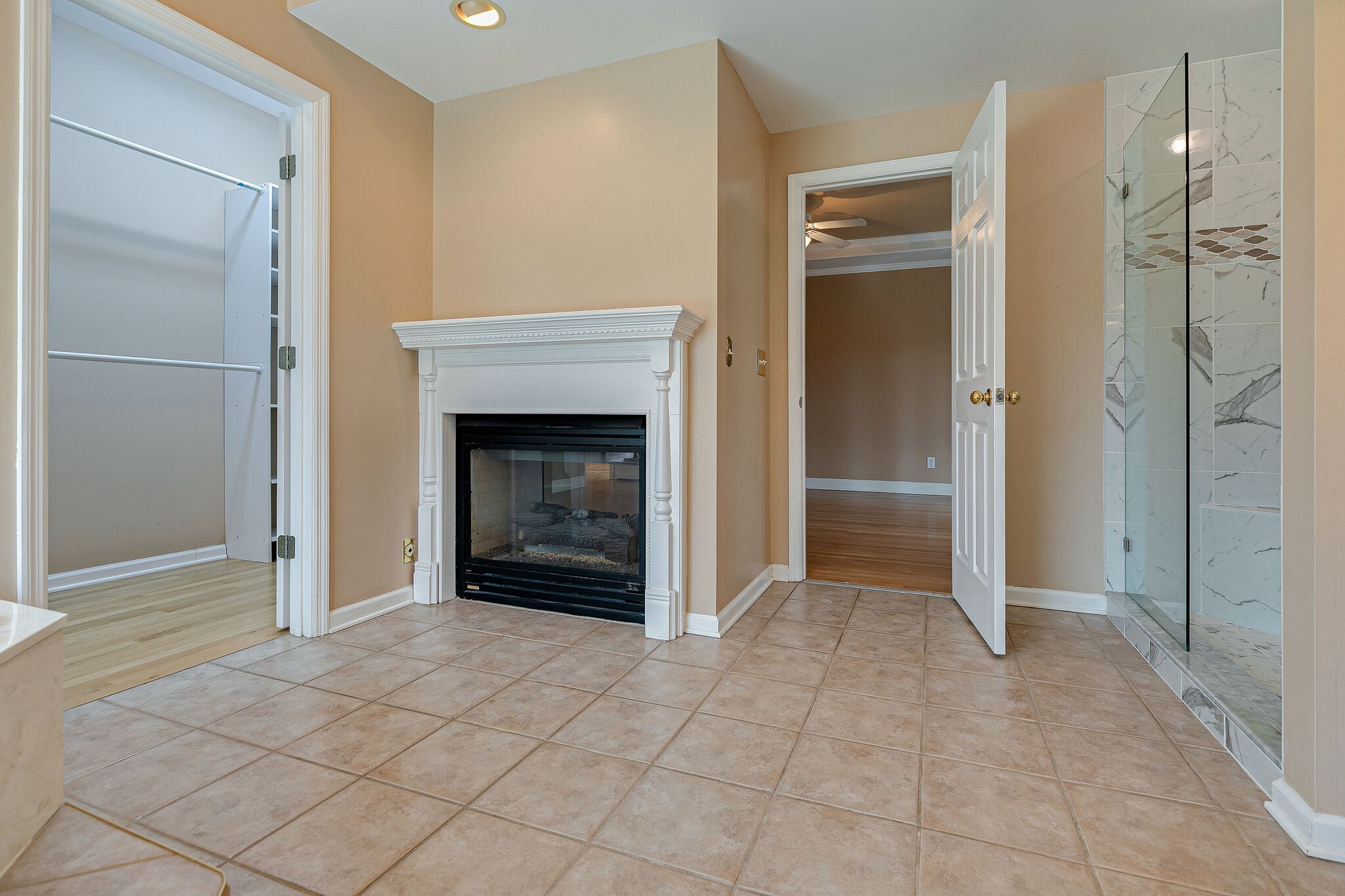 Undisclosed Address Franklin, TN 37064 - Photo 22 of 67 a view of an empty room with a fireplace