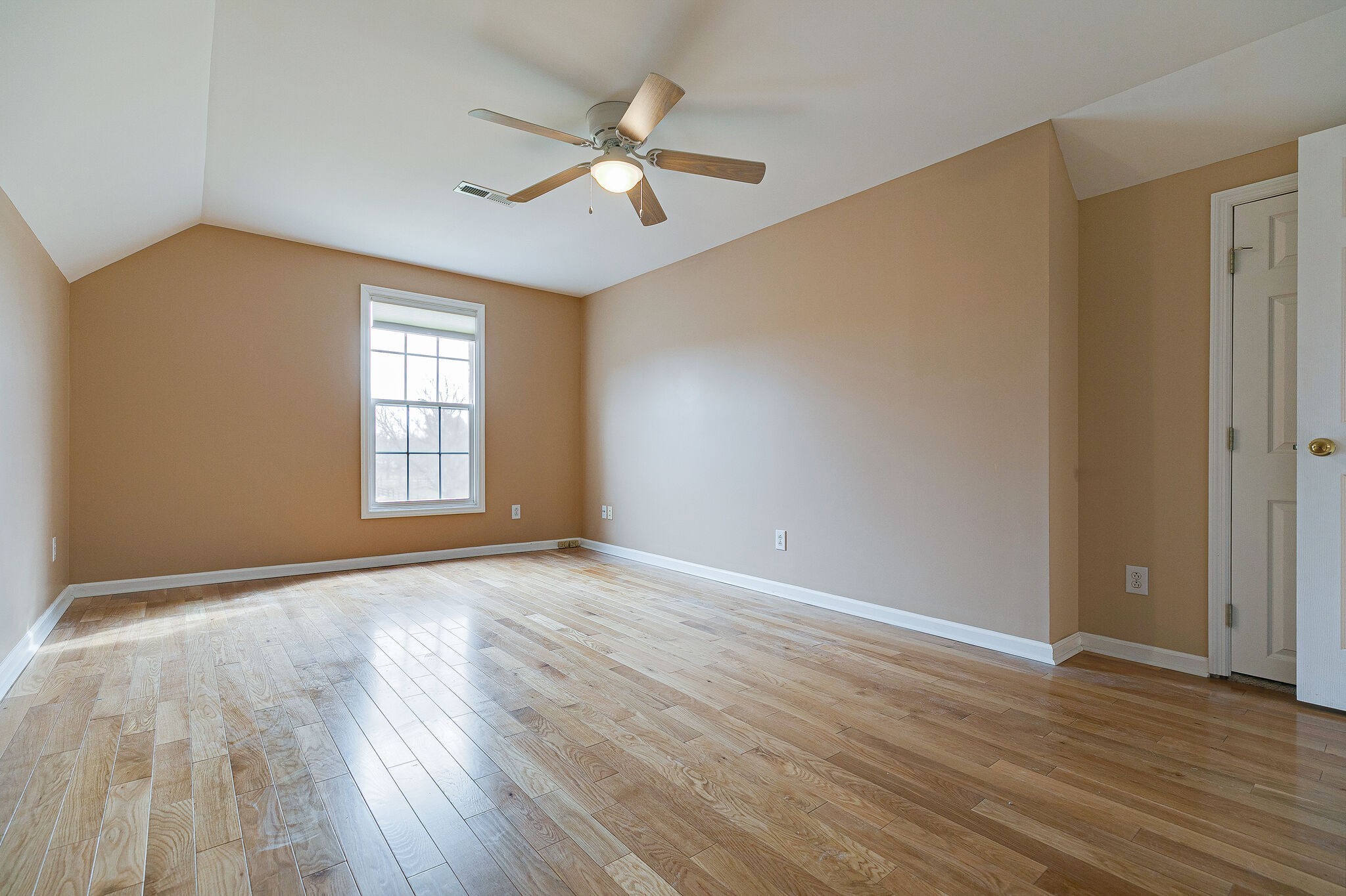 Undisclosed Address Franklin, TN 37064 - Photo 31 of 67 a view of an empty room with wooden floor and a window