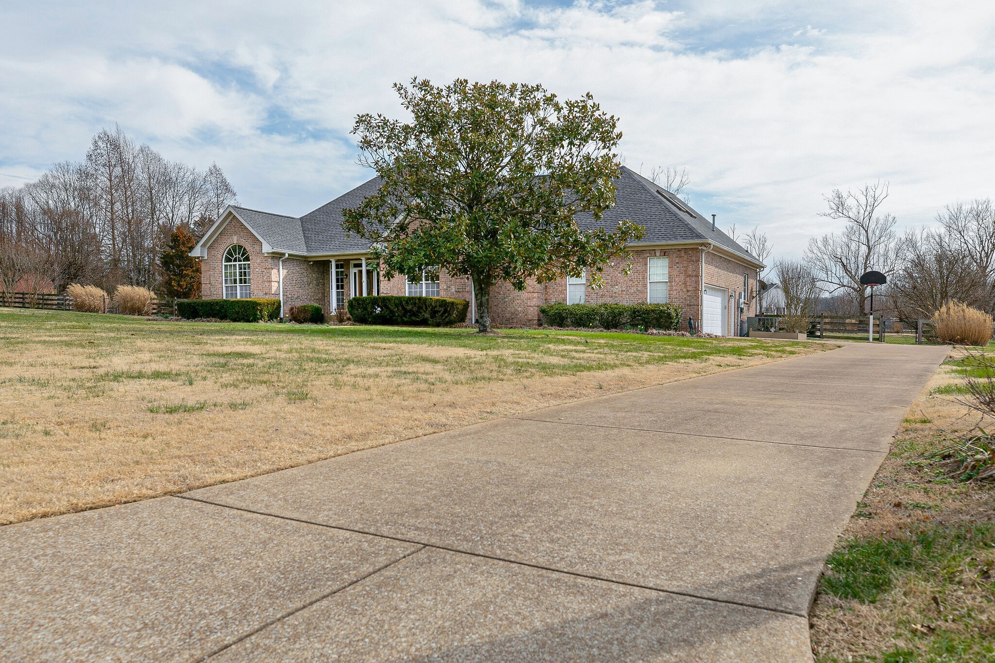Undisclosed Address Franklin, TN 37064 - Photo 4 of 67 a yellow house with trees in front of it