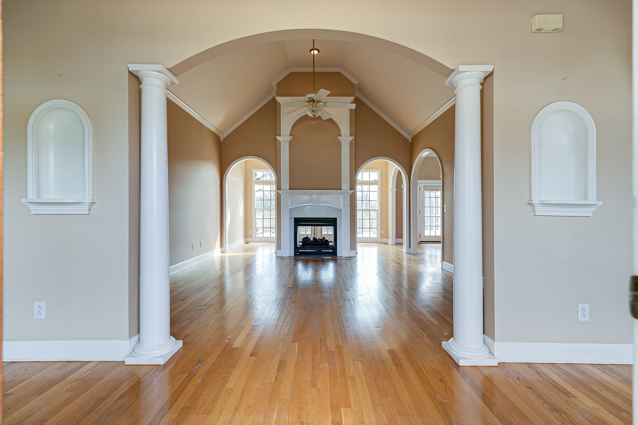 Undisclosed Address Franklin, TN 37064 - Photo 6 of 67 a view of a livingroom with wooden floor fireplace and windows